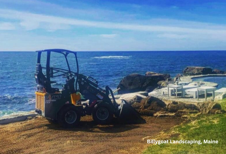 GiANT G1200 sits on a landscaping site with a bucket attachment next to the ocean in Maine.
