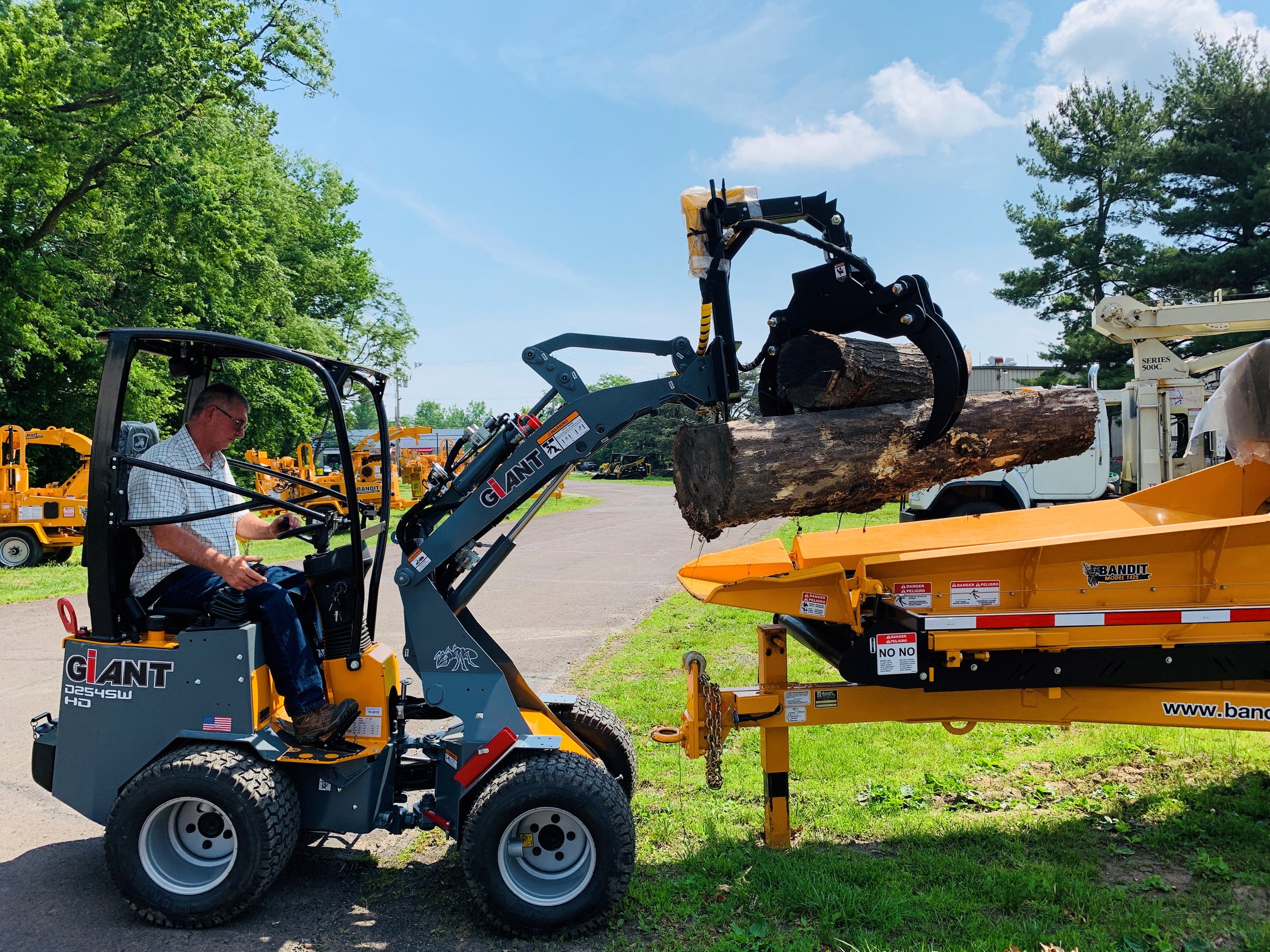 Giant loader moving tree trunk